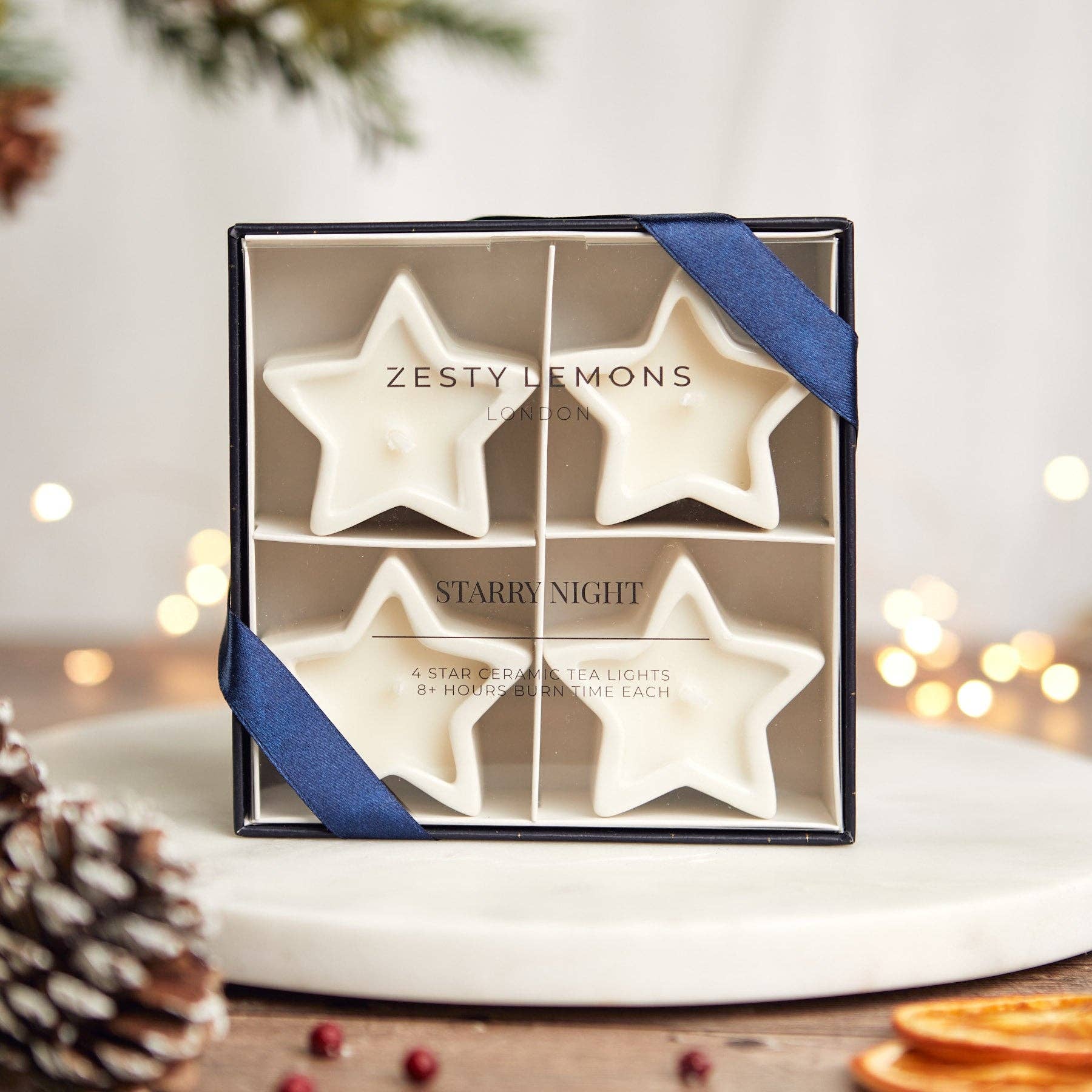 Coffret Zesty Lemons contenant quatre bougies en céramique en forme d’étoile parfum Starry Night.