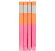 Lot de quatre bougies tricolores orange, neyron et rose, fabriquées à la main en cire végétale dans le cadre du commerce équitable.