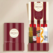 Boîte d’allumettes illustrée Christmas Spritz de Zesty Lemons, couleurs bordeaux et doré, avec 10 allumettes design et recette de cocktail à l’intérieur.